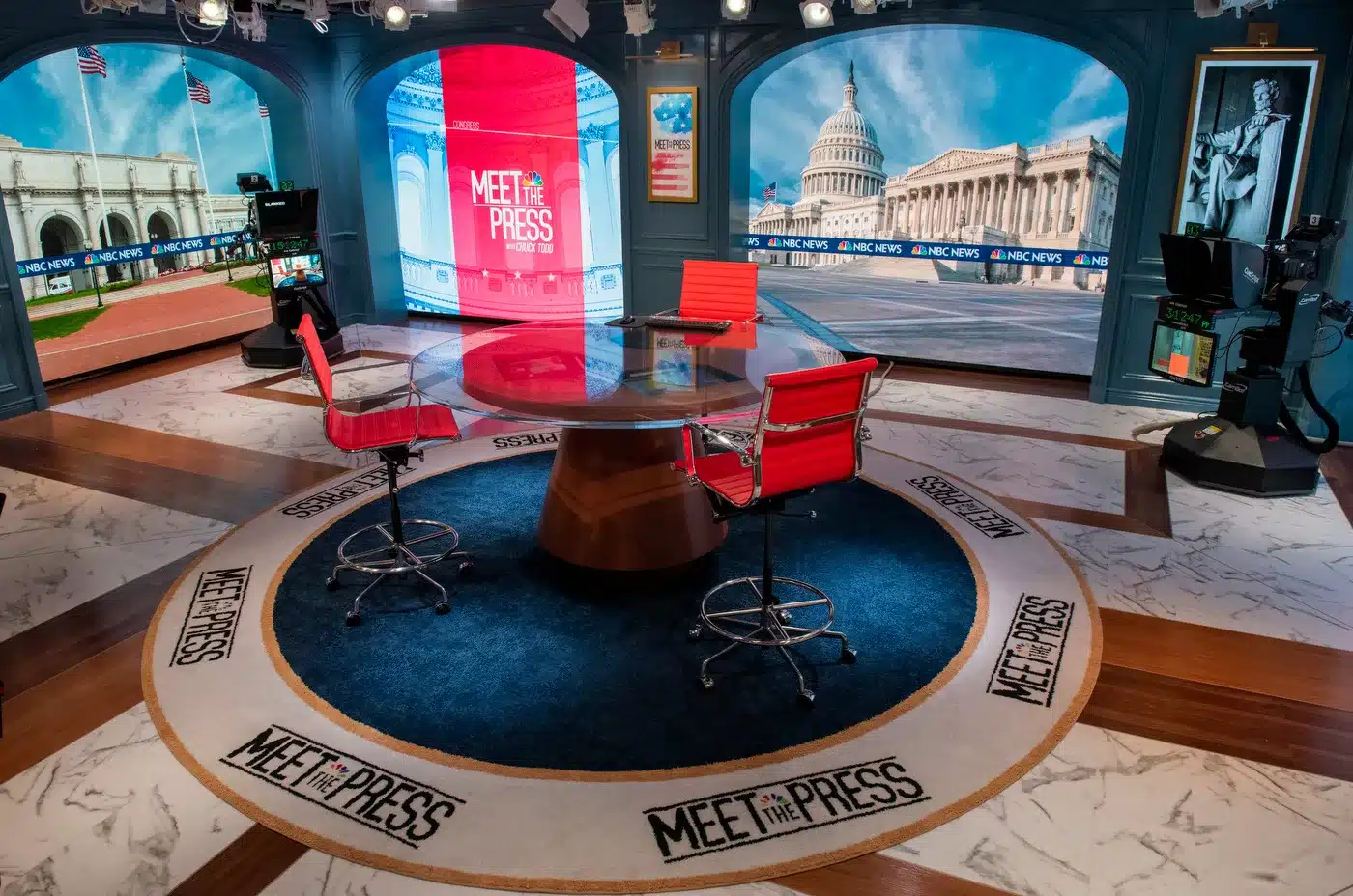 Meet the Press' studio featuring red chairs, LED screens & D.C. landmarks backdrop